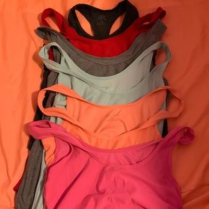 set of 6 no boundaries work-out tank tops.